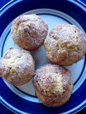 A plate with mini cinnamon muffins on it.
