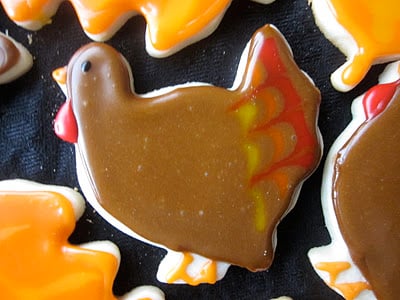 Turkey decorated sugar cookie on a black table. 